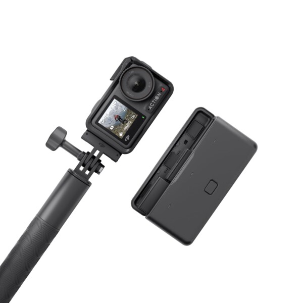 a black camera on a stick